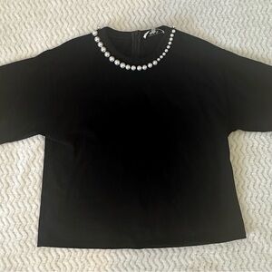 Elegant Black Top with Pearl Accents